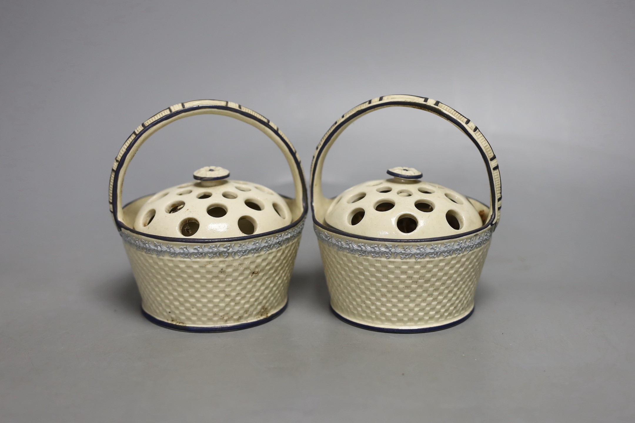 A pair of early 19th century creamware pot pourri baskets - 12cm high